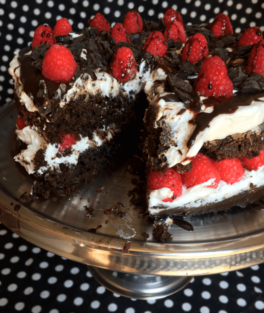 Healthy-ish chocolate cake with raspberries and whipped cream 