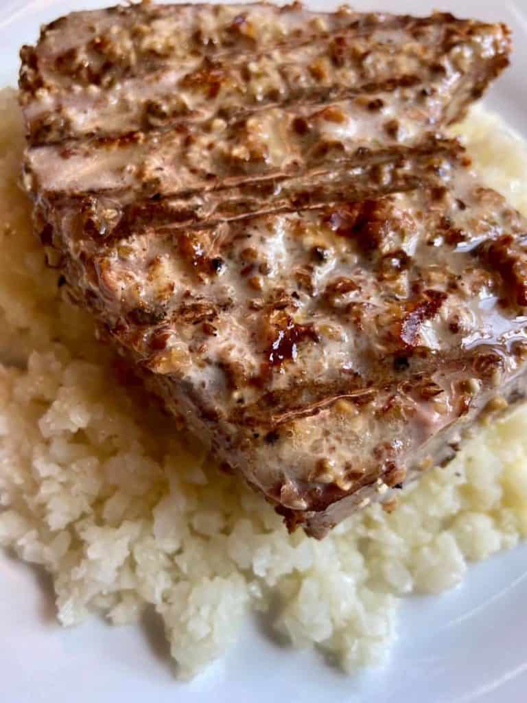 tuna steaks with cauliflower rice under it. 