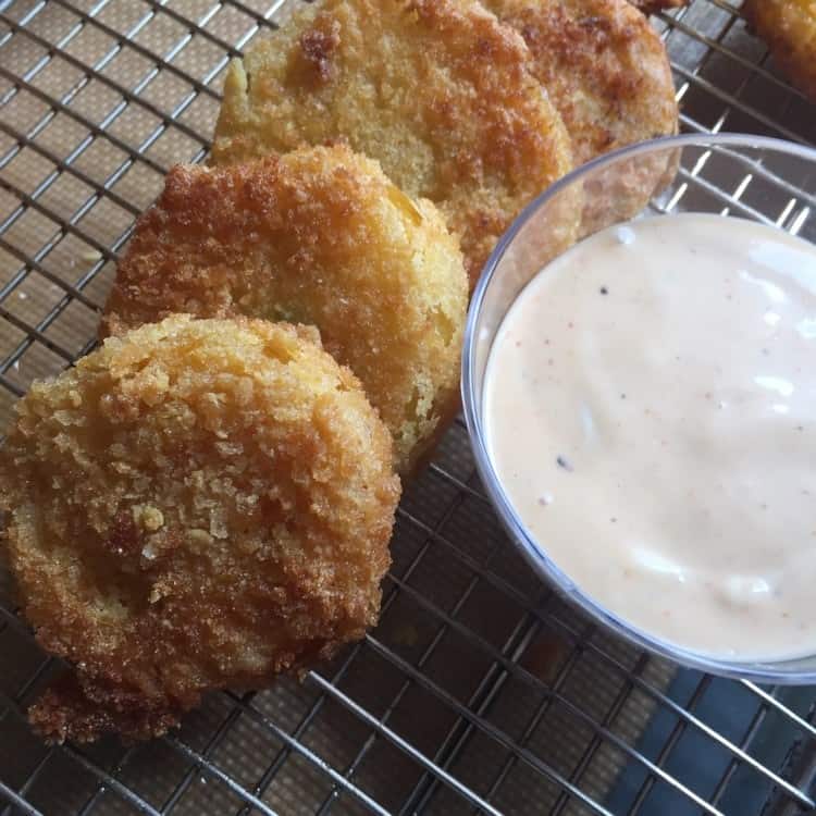 fried green tomatoes next to dipping sauce