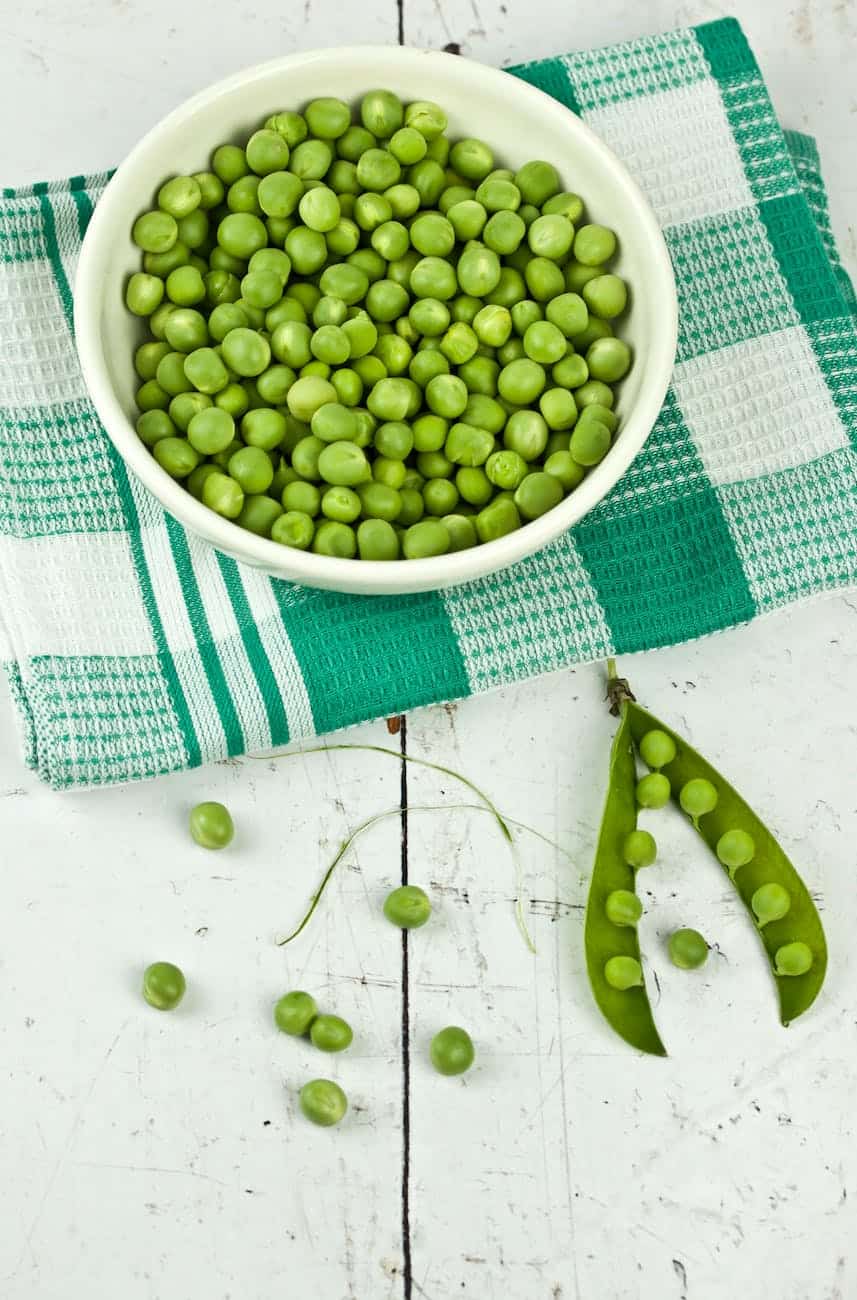 green peas on white ceramic bowl