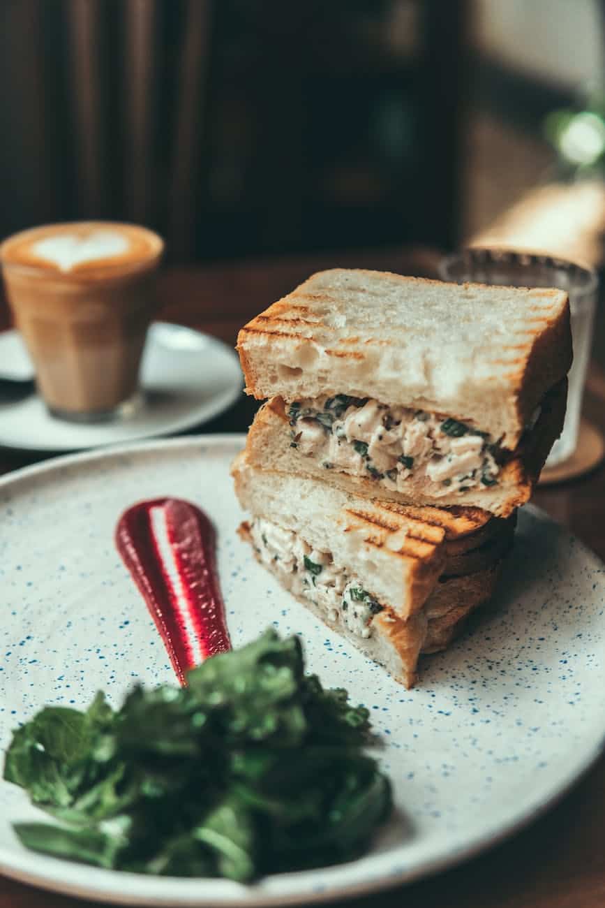 delicious toast with tuna fish and sauce on table